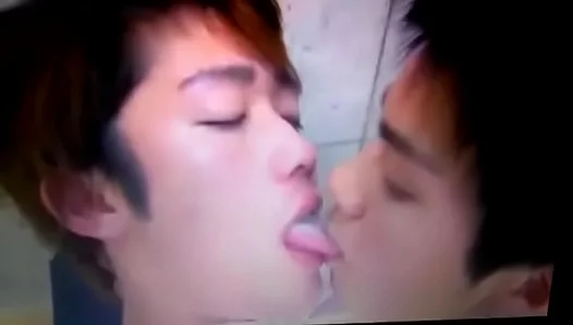 Steamy Passion: Young Asian Twins Share a Deep, Wet Tongue Kiss – 18+