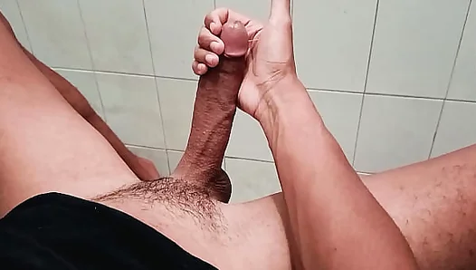 Alone in the Bathroom, Jerking Off His Huge Dick for a Powerful Load – Steamy Solo Play